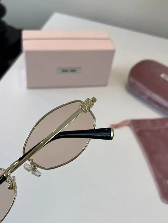 Miu Miu Cat-Eye Sunglasses with Gold Frames and Pink Lenses - Picture 6 of 7